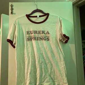 Cream colored Eureka Springs Shirt w/ maroon edging